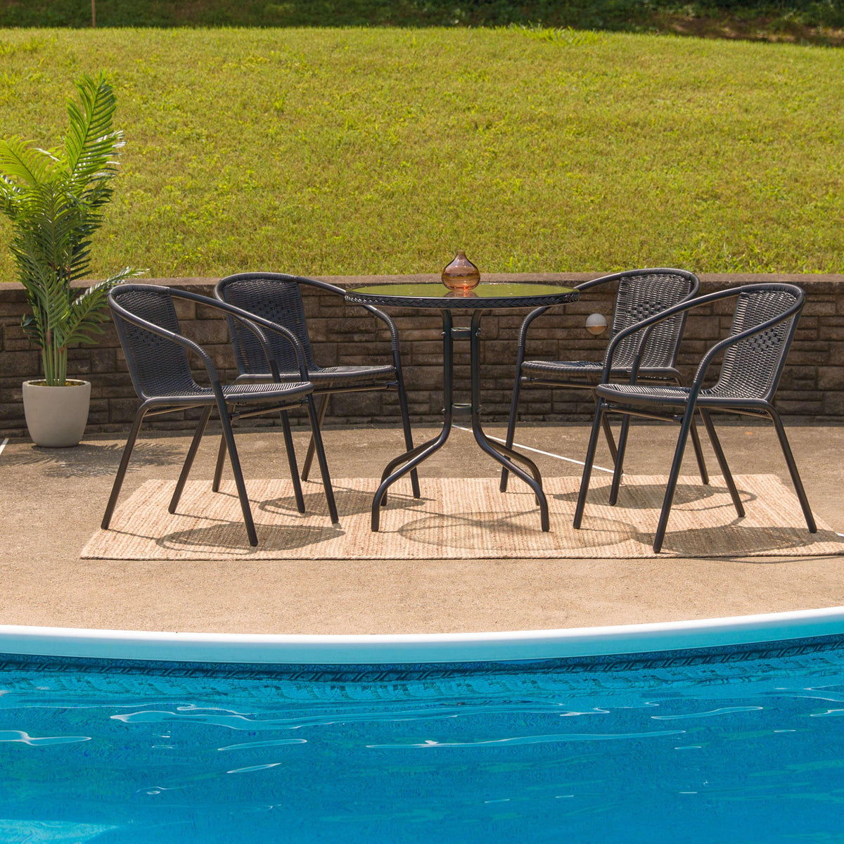 Clear/Black |#| 28inch RD Glass Metal Table with Black Rattan Edging & 4 Black Rattan Stack Chairs