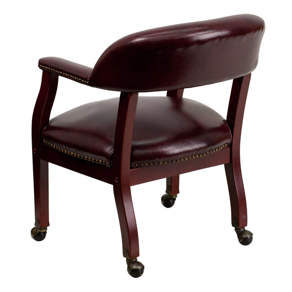 Oxblood Vinyl |#| Oxblood Vinyl Luxurious Conference Chair with Accent Nail Trim and Casters