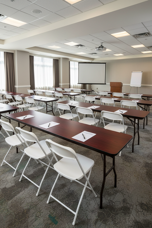 Bizchair-mahogany-laminate-folding-table-white-hercules-plastic-chair-conference-center